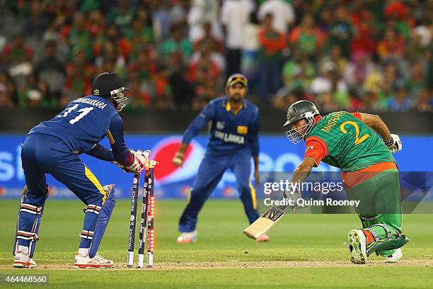 Mashrafe Mortaza of Bangladesh is stumpby Kumar Sangakkara of Sri Lanka during the 2015 ICC Cricket World Cup match between Sri Lanka and Bangladesh...