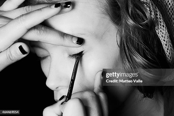 Model is seen backstage ahead of the Max Mara show during the Milan Fashion Week Autumn/Winter 2015 on February 26, 2015 in Milan, Italy.