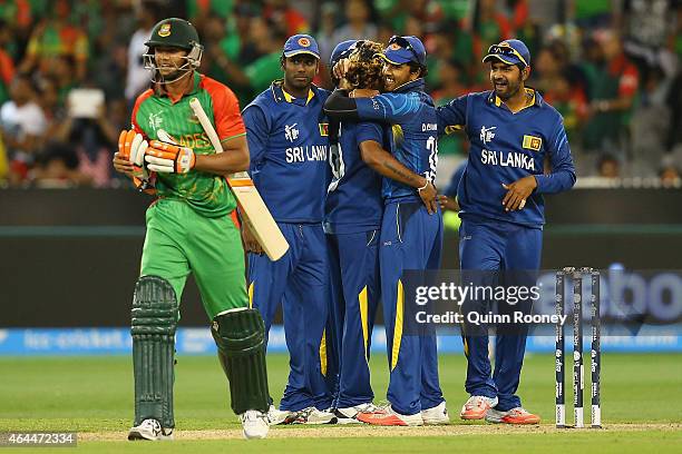 Lasith Malinga of Sri Lanka is congratulated by team mates after getting the wicket of Taskin Ahmed of Bangladesh during the 2015 ICC Cricket World...