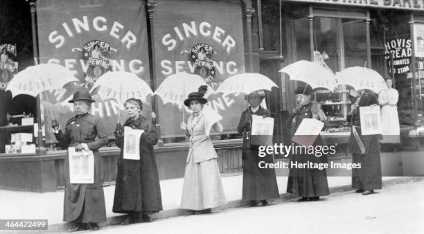 Parasol parade selling The Suffragette newspaper, Brighton, Sussex, April 1914. From left to right: Miss Reid, Mrs Goodier, Miss Gye, Mrs Brandon,...