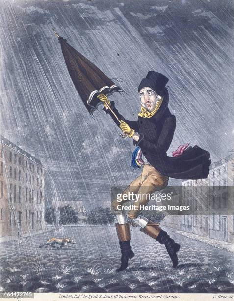 Soaker or a Real Cat and Dog Day', 1825; shows a rainy London street. A man tries to open his umbrella and a soaked dog runs past.