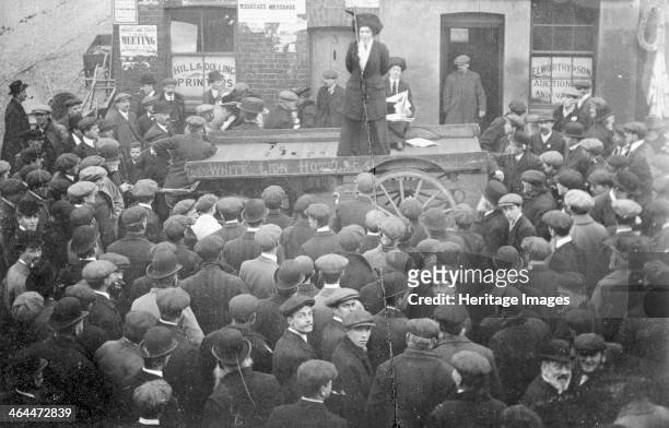 Isabel Seymour addressing a crowd of men and boys from a tradesman's cart, 1908. Seymour worked in the office and Clement's Inn, and was a close...