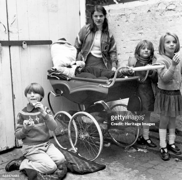 Children playing 'Penny for the Guy' in a London yard, Oct 1978.