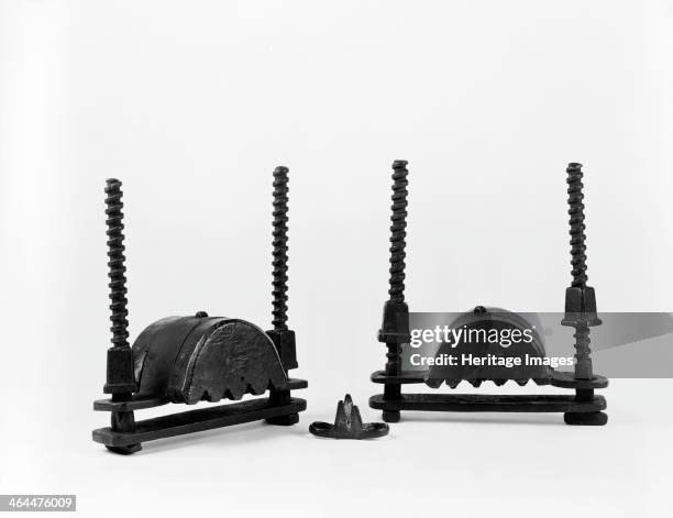 Two hand crushers and a knuckle duster, late Tudor, c1600.