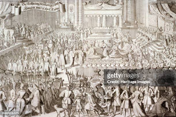 Coronation of William III and Mary II in Westminster Abbey, London, 1689. The king and queen are shown kneeling on cushions whilst the crowns are...