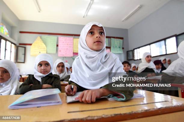 Yemeni schoolgirls attend a class on February 26, 2015 in the capital Sanaa. Yemen, long on the front line in the fight against Al-Qaeda, has been...