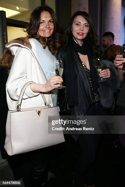 Guests attend the 'Marie Claire Loves Art, Celebrating 20 Italian Artists' Exhibition Opening on February 25, 2015 in Milan, Italy.