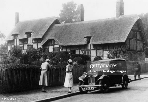 Triumph Super Nine Saloon at Anne Hathaway's cottage, Shottery, Warwickshire, c1933. Anne Hathaway was the wife of author William Shakespeare.