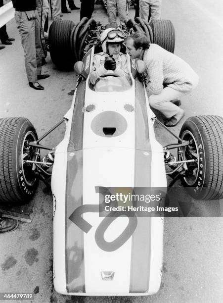 John Surtees in Honda V12, Belgian Grand Prix, 1968. He failed to finish the race, retiring on lap 11 with suspension trouble. John Surtees came to...