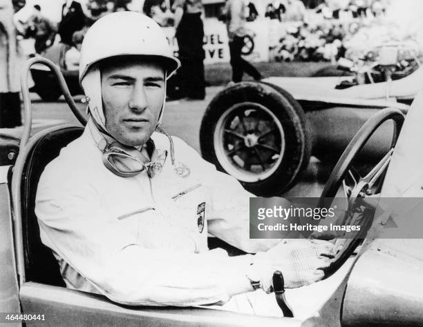 Stirling Moss at Goodwood, 1954. At the wheel of a Maserati, Moss came first in this race. He began his career in 1947 driving a BMW 328. In 1955 he...