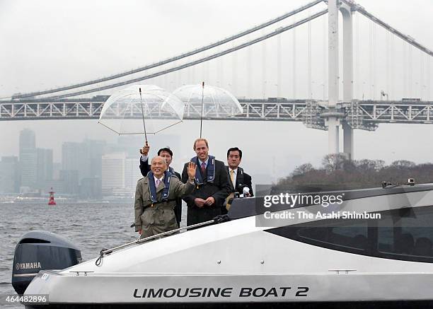 Prince William, Duke of Cambridge and Tokyo Governor Yoichi Masuzoe stand on the stern of a boat as they tour the Tokyo Bay area on February 26, 2015...