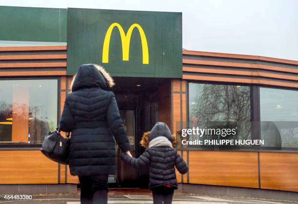 Container with a drink is served at the McDonald's fast-food outlet on February 26, 2015 in Lille, northern France. Several labour unions and a...