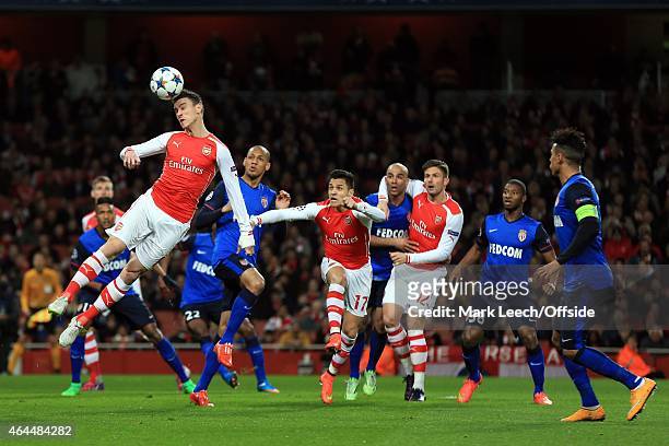 Laurent Koscielny of Arsenal heads the ball during the UEFA Champions League round of 16, first leg match between Arsenal and Monaco at The Emirates...