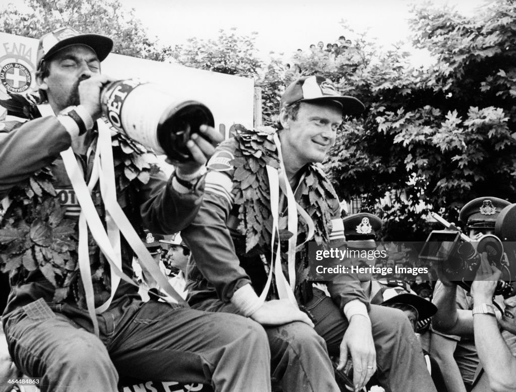 Hans Thorszelius drinking champagne and Bjorn Waldegaard, winners of the Acropolis Rally, 1979.