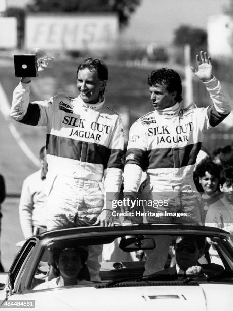 John Watson and Jan Lammers waving at the crowds at Jarama, Spain, 1987. They had won the opening round of the FIA World Sports-Prototype...