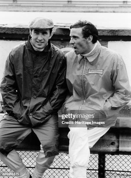 Jackie Stewart on the left, and Jim Clark, 1967. Chatting at the side of the track, at the Italian Grand Prix at Monza. Stewart's career lasted until...