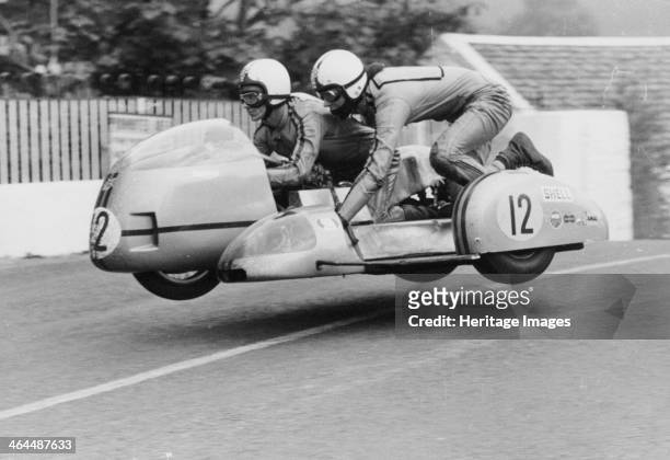 Sidecar TT race, Isle of Man, 1970. This motorcycle and sidecar combination are airborne as they cross Ballaugh Bridge on the TT circuit.