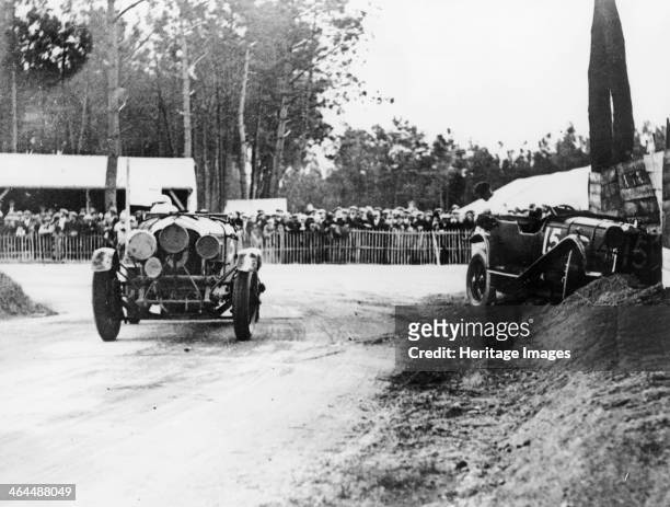 Bentley passing crashed Lagonda, Le Mans 24 Hours, 1928. The 4.5 litre Bentley of Henry Birkin and Jean Chassagne passes the abandoned Lagonda 2...