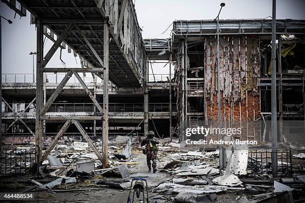 Pro-Russian rebel walks amongst the wreckage of the destroyed Donetsk airport on February 26, 2015 in Donetsk, Ukraine. The Donetsk airport has been...