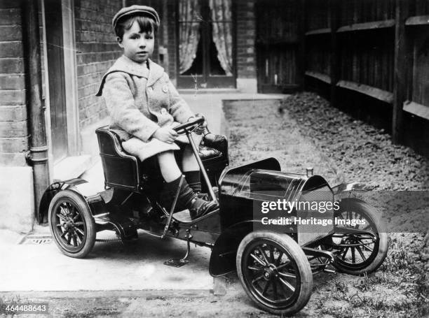 Boy in 1908 Mercedes 28/32 hp pedal car, c1908. This pedal Mercedes 28/32 hp was made by Felix Hoddess in 1908 for his son Maurice.