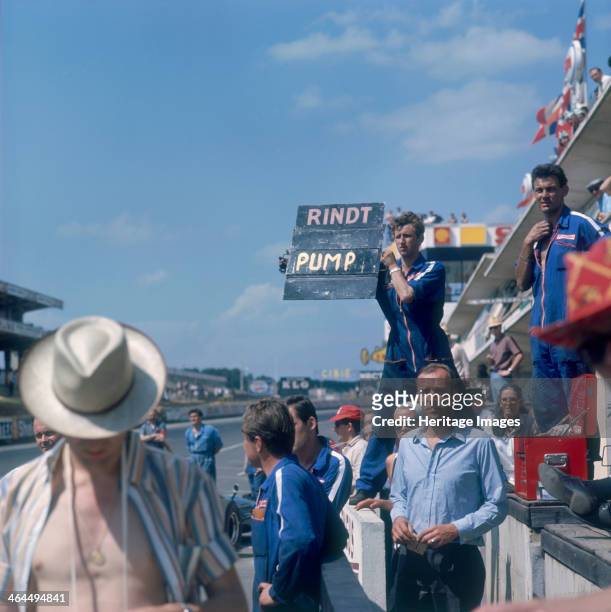 Mechanic holding up a sign, French Grand Prix, Le Mans, France, 1967. The sign has Jochen Rindt's name on it. This Grand Prix was held at the new...