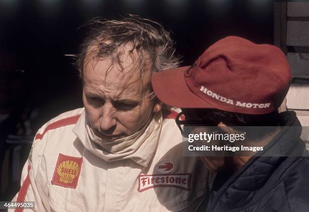 John Surtees, during his time with the Honda Formula One team, circa 1967. He came to car racing in 1959 after a highly successful motorcycle racing...