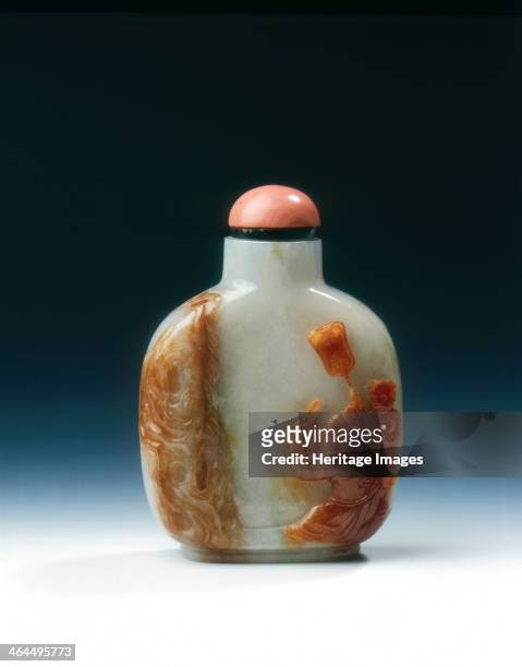 Jadeite snuff bottle with four different colours, Qing dynasty, China, 19th century. A snuff bottle of white jadeite with traces of lavender, and...