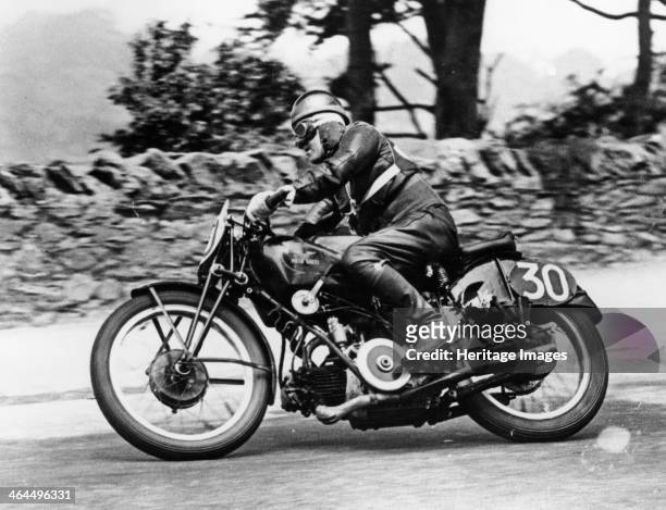 Stanley Woods on a 498cc Moto Guzzi bike, Isle of Man Senior TT, 1935. This was his most famous win. He was expected to stop at the end of the sixth...