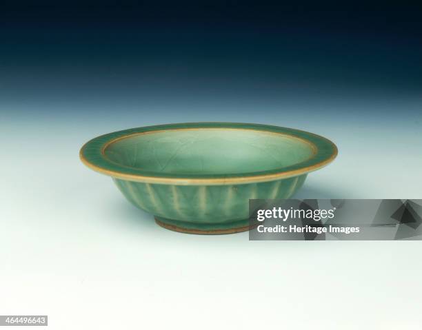 Longquan celadon double fish saucer bowl, Song-Yuan dynasty, China, 13th century. A celadon double fish saucer bowl with blue-green celadon colour...