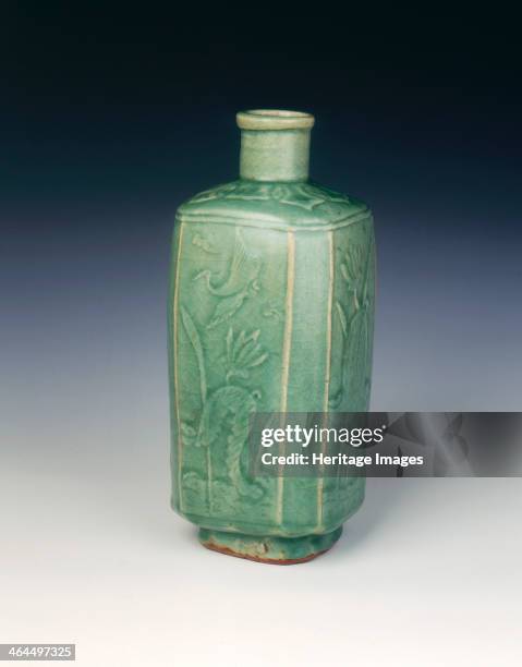 Squared celadon glazed bottle with carved birds and flowers, late Ming dynasty, China, early 17th century. A carved celadon bottle of upright...