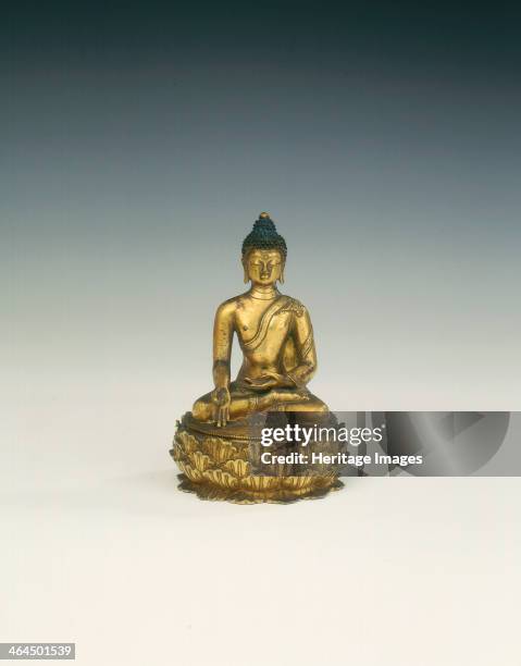 Gilt brass Ratnasambhava, patron saint of Nyingmapa sect, Mongolia, 18th century. Figure of Ratnasambhava seated in meditation pose. The figure sits...