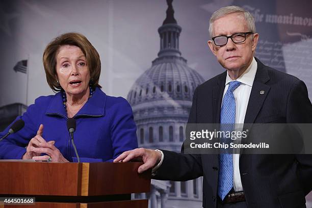 Senate Minority Leader Harry Reid and House Minority Leader Nancy Pelosi answer reporters' questions during a news conference in the Radio Television...