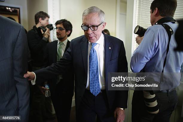 Senate Minority Leader Harry Reid leaves a news conference in the Radio Television Gallery at the U.S. Capitol February 26, 2015 in Washington, DC....