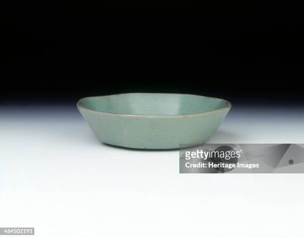 Celadon octagonal bowl, Koryo dynasty, Korea, 1150-1200. A celadon octagonal bowl with slightly flaring sides. There is faint moulded decoration of...