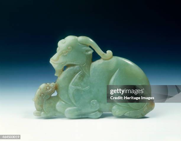 Jade mythical animal and young plaque, Yuan or early Ming dynasty, China, 14th-15th century. A celadon jade plaque of one-horned mythical animal and...