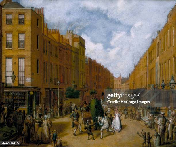 'Sweeps' Day in Upper Lisson Street, Paddington', late 1830s. London street with a Jack-in-the-Green procession and a number of boy chimney sweeps...