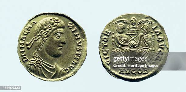 Gold solidus of Magnus Maximus, c383-c388 AD. The obverse shows the emperor's head, and the reverse shows the mint mark AVG OB , 'pure gold of...