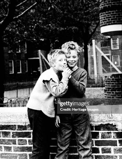 Boys smoking a cigarette, north-west London, 1967.