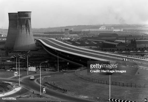 Tinsley Viaduct on the M1 after completion, Sheffield, South Yorkshire, 1968. The twin cooling towers of Blackburn Meadows Power Station which many...