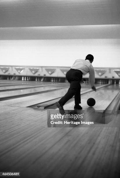 Ten pin bowling, Sheffield, South Yorkshire, 1964. During a social evening organised by Edgar Allen's Steel foundry in Sheffield, an employee...