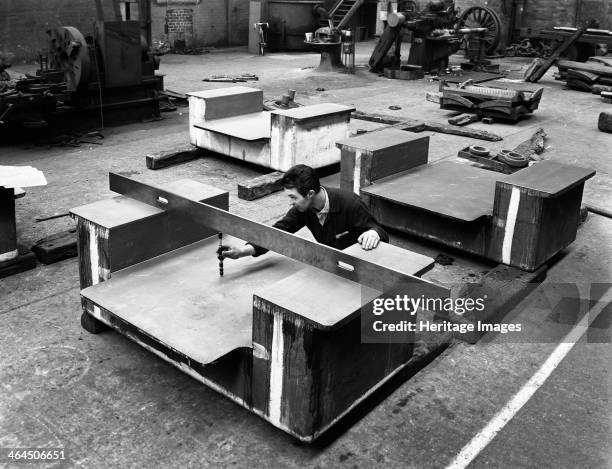 An engineer at work at the Edgar Allen Steel Foundry, Sheffield, South Yorkshire, 1962. An engineer using a precision depth guage to quality check a...