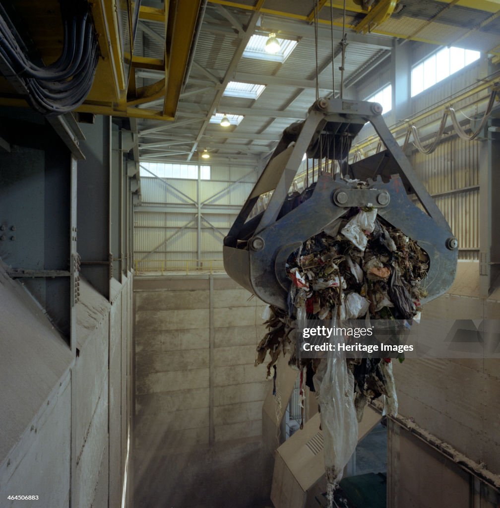 Waste ready for incineration in giant crane grab jaws, St Helier, Jersey, 1980. Artist: Michael Walters
