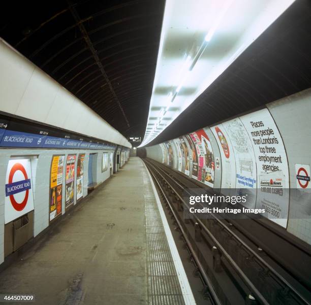 Empty tube station, Blackhorse Road on the Victoria Line, London, 1974. Period posters on the wall include adverts for Marlboro Cigarettes and the...