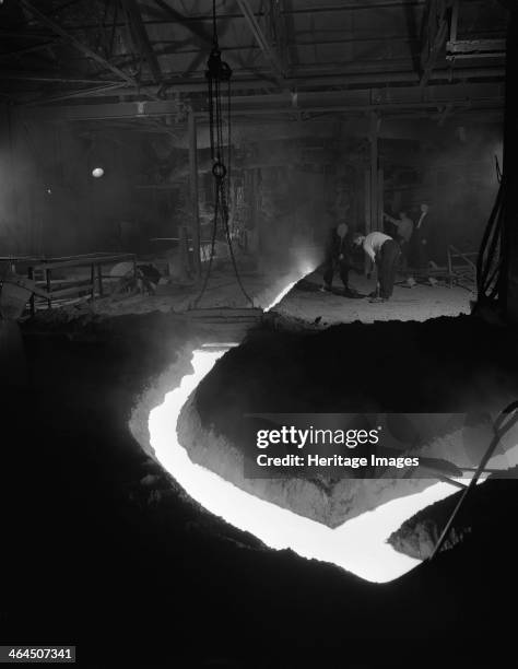 Molten steel being channelled at the Stanton Steel Works, Ilkeston, Derbyshire, 1962. Iron production had taken place in the Ilkeston area since...