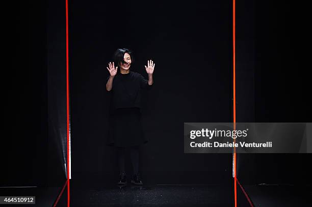 Designer Izumi Ogino acknowledges the applause of the audience after the Anteprima show during the Milan Fashion Week Autumn/Winter 2015 on February...