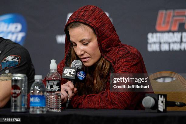 Miesha Tate answers questions from the media at the UFC 168 post fight press conference at the MGM Grand Garden Arena on December 28, 2013 in Las...