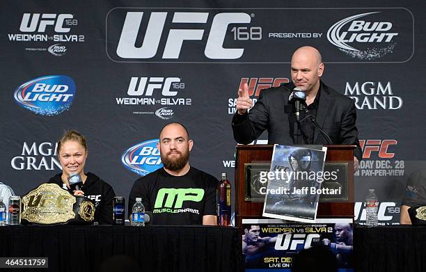 Ronda Rousey speaks to the media with Travis Browne and UFC President Dana White on stage at the UFC 168 post fight press conference at the MGM Grand...
