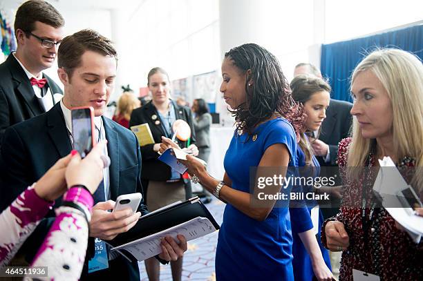 Rep. Mia Love, R-Utah, gives an autograph to a CPAC attendee following her appearance on stage at CPAC in National Harbor, Md., on Feb. 26, 2015.