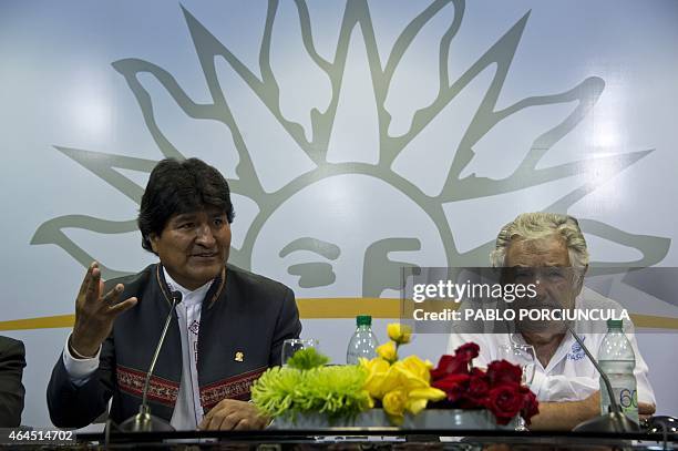 Uruguay's President Jose Mujica and his Bolivian counterpart Evo Morales speak with press after signing agreements in Montevideo on February 26 two...