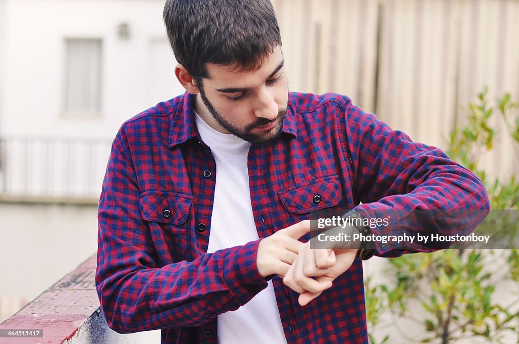 Man looking at his watch